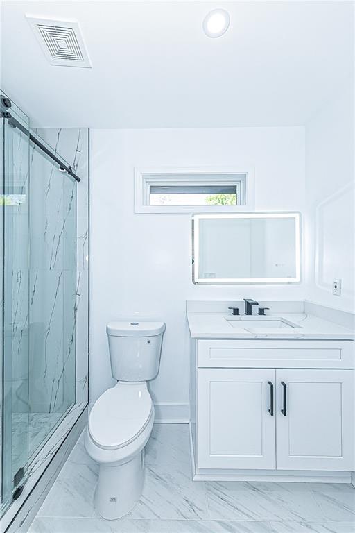 3013 Catalina Drive Decatur, GA 30032 - Photo 27 of 48 a bathroom with a toilet sink vanity and mirror