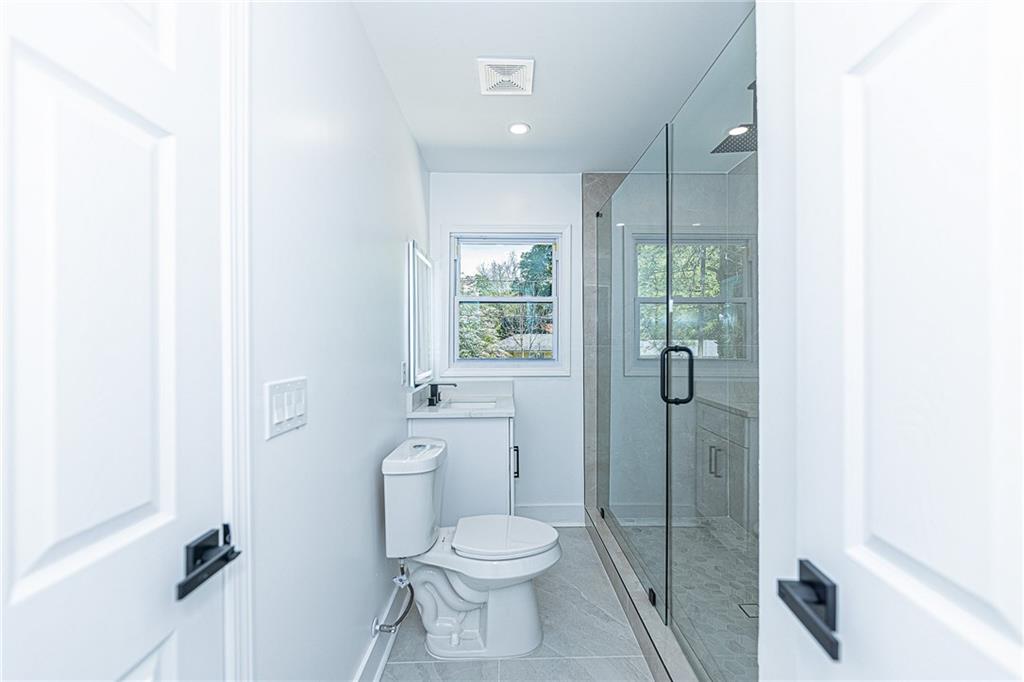 3013 Catalina Drive Decatur, GA 30032 - Photo 34 of 48 a bathroom with a toilet sink and a shower