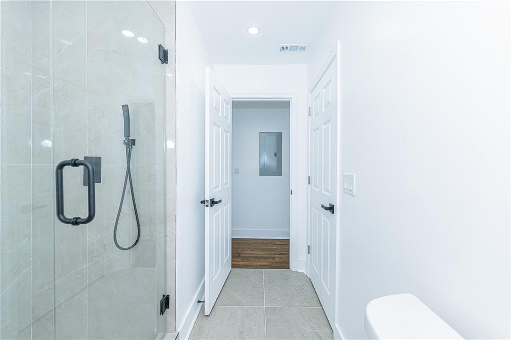 3013 Catalina Drive Decatur, GA 30032 - Photo 35 of 48 a bathroom with a granite countertop shower and a toilet