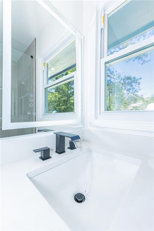 3013 Catalina Drive Decatur, GA 30032 - Photo 36 of 48 a bathroom with a tub sink and window