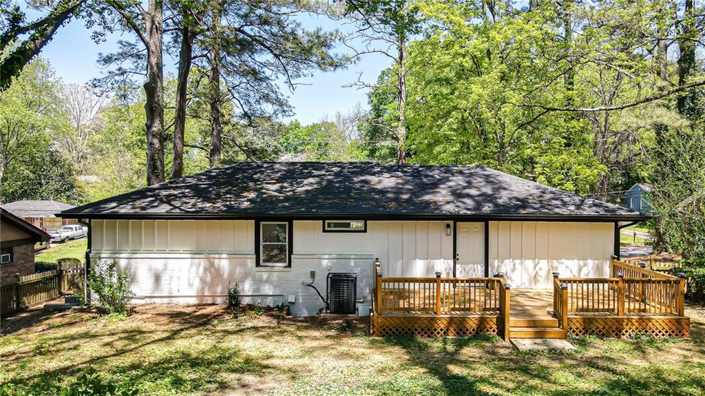 3013 Catalina Drive Decatur, GA 30032 - Photo 42 of 48 a view of a patio with table and chairs under an umbrella
