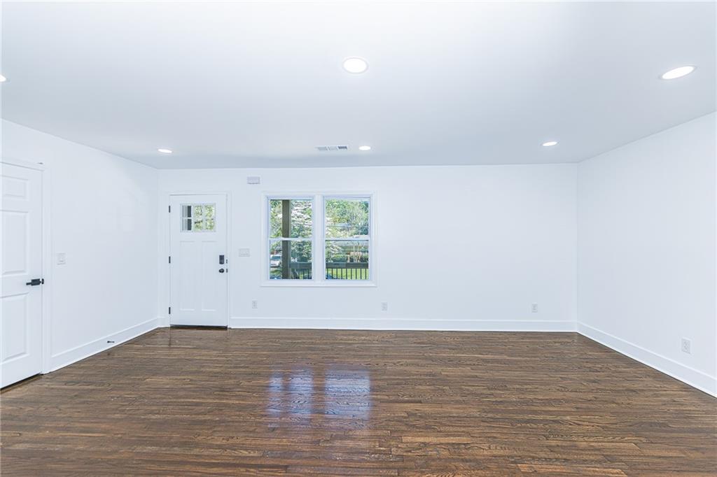 3013 Catalina Drive Decatur, GA 30032 - Photo 6 of 48 wooden floor in an empty room with a window