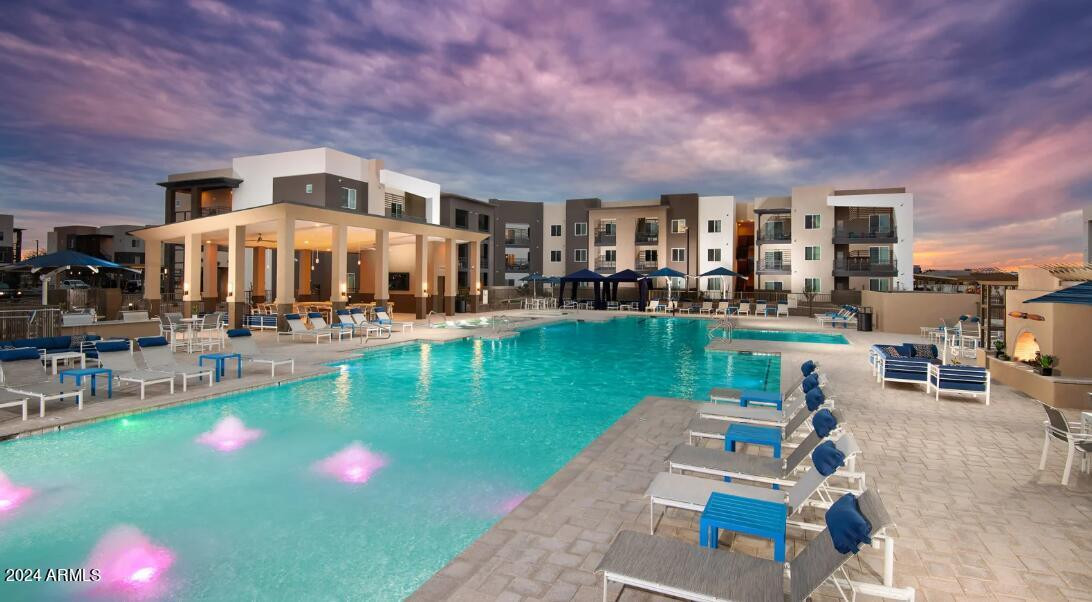 1441 East Germann Road, Unit 3 Chandler, AZ 85286 - Photo 6 of 21 a swimming pool view with a seating space and garden view