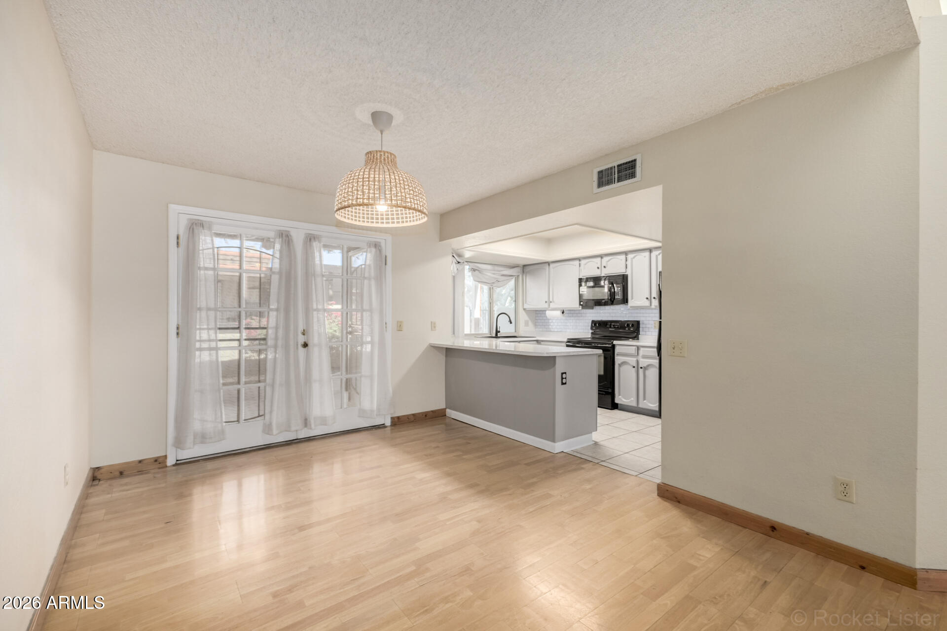 3004 West Phelps Road Phoenix, AZ 85053 - Photo 11 of 34 a view of a kitchen with a sink and cabinets