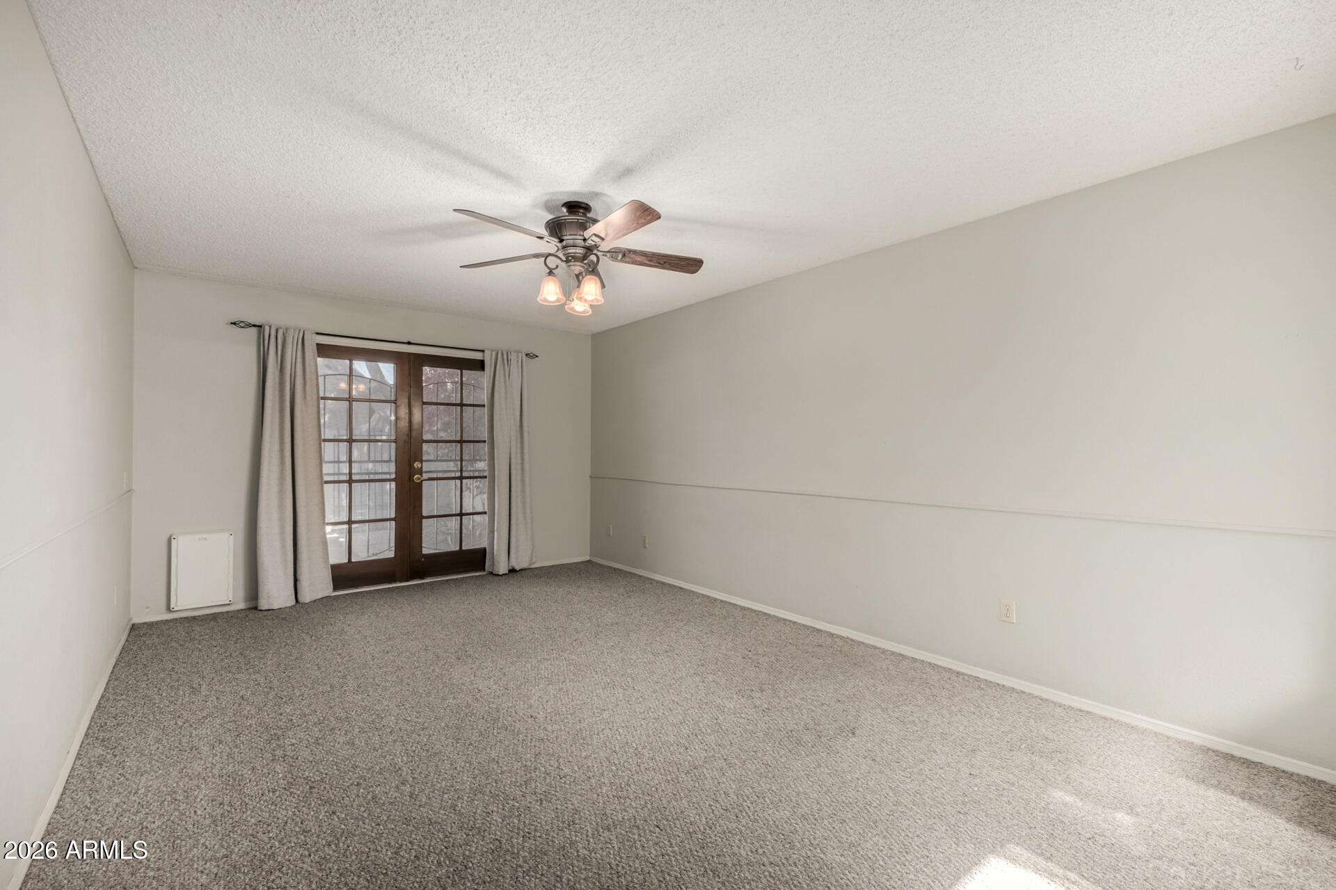3004 West Phelps Road Phoenix, AZ 85053 - Photo 15 of 34 an empty room with windows