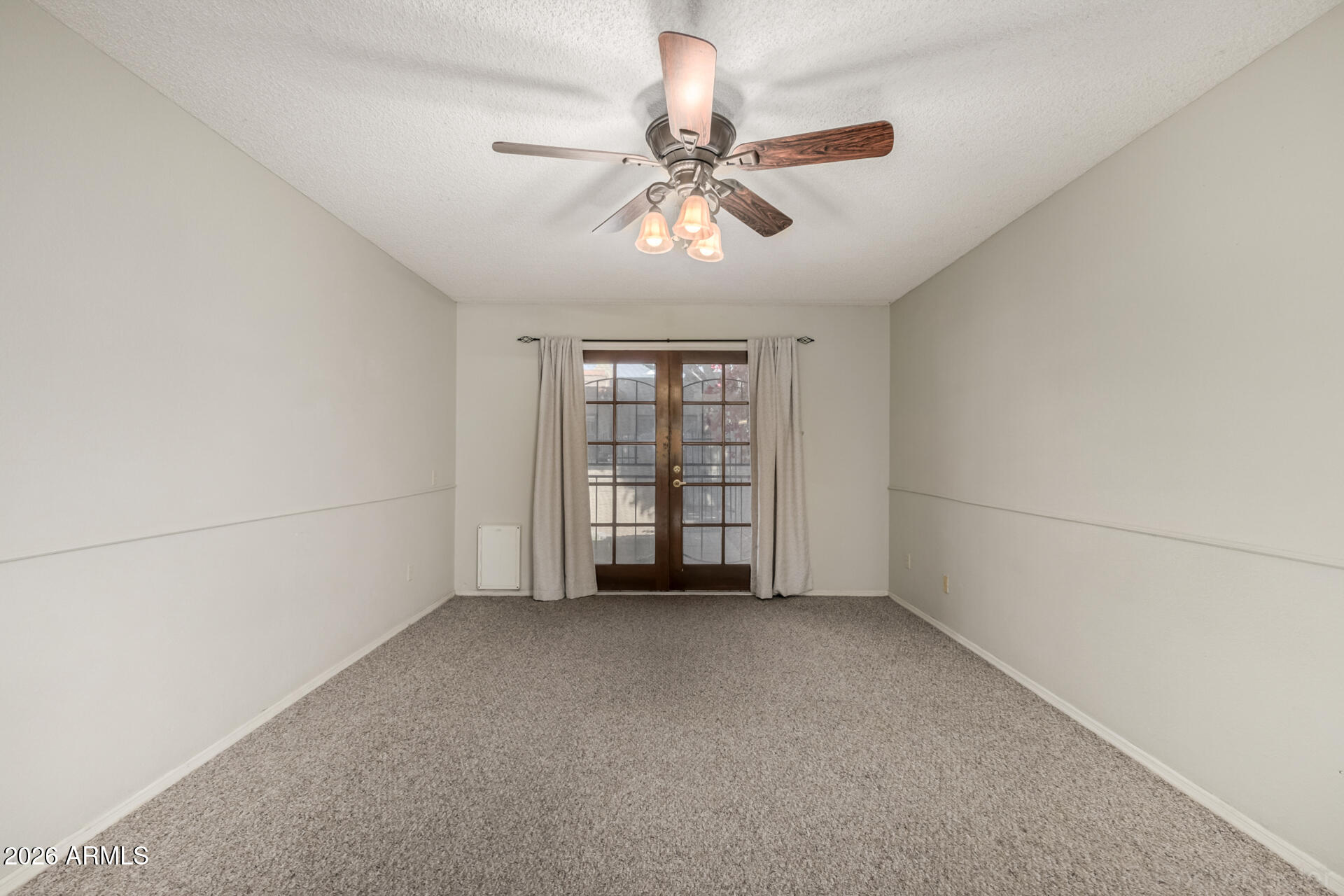 3004 West Phelps Road Phoenix, AZ 85053 - Photo 16 of 34 a view of an empty room with a window