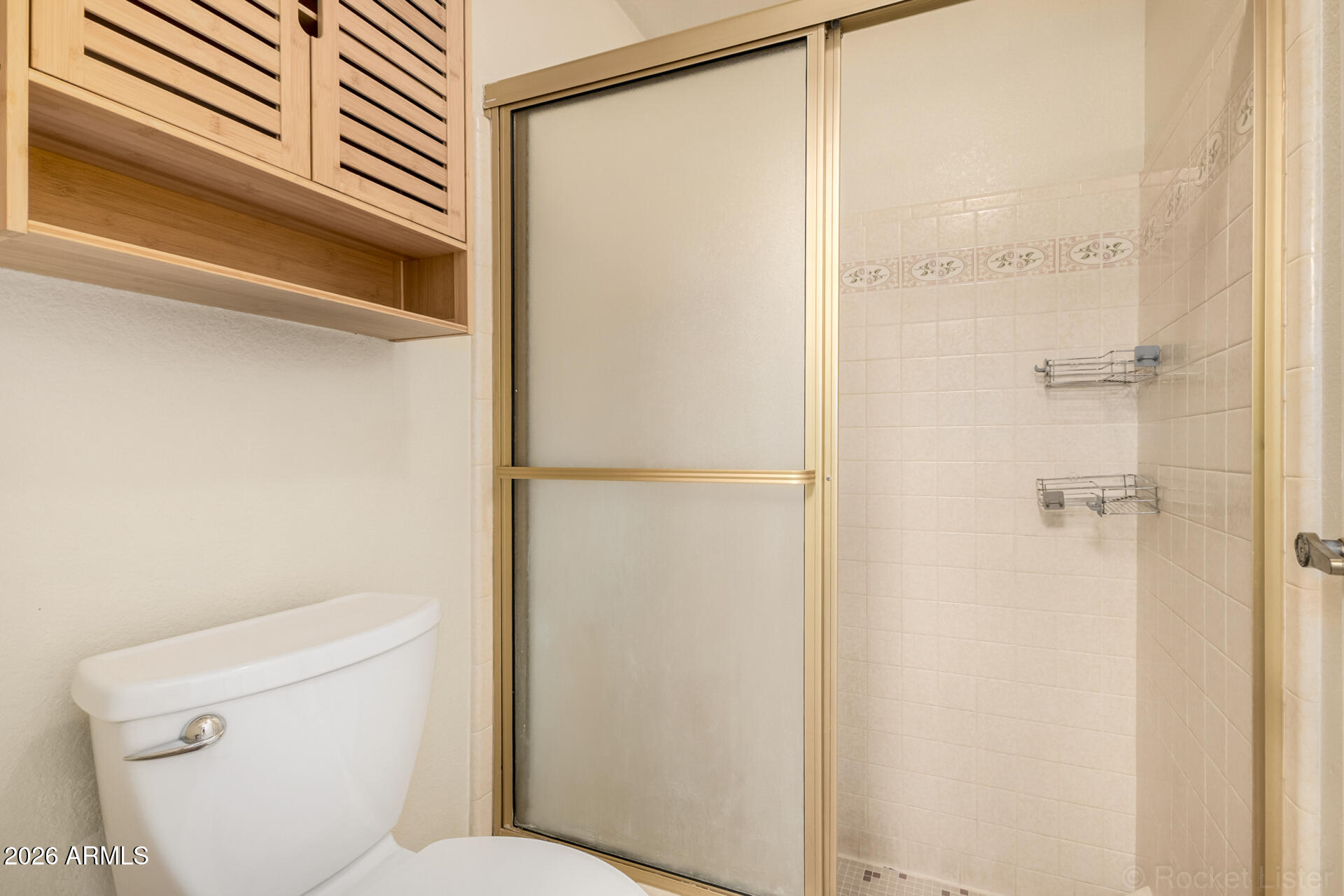3004 West Phelps Road Phoenix, AZ 85053 - Photo 19 of 34 a bathroom with a toilet and a shower