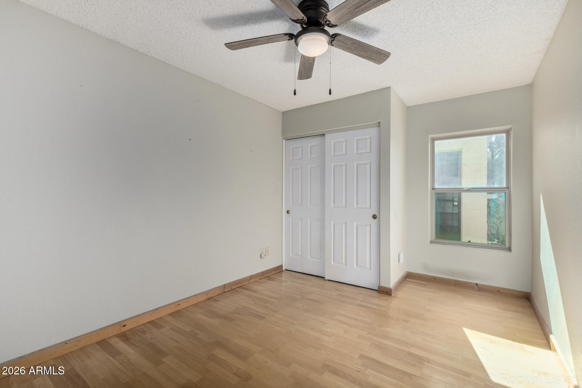 3004 West Phelps Road Phoenix, AZ 85053 - Photo 21 of 34 a view of an empty room with a window