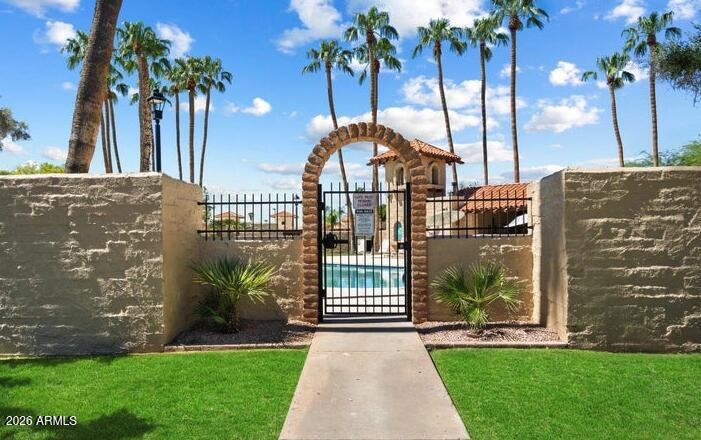 3004 West Phelps Road Phoenix, AZ 85053 - Photo 32 of 34 a view of a house with a yard and potted plants
