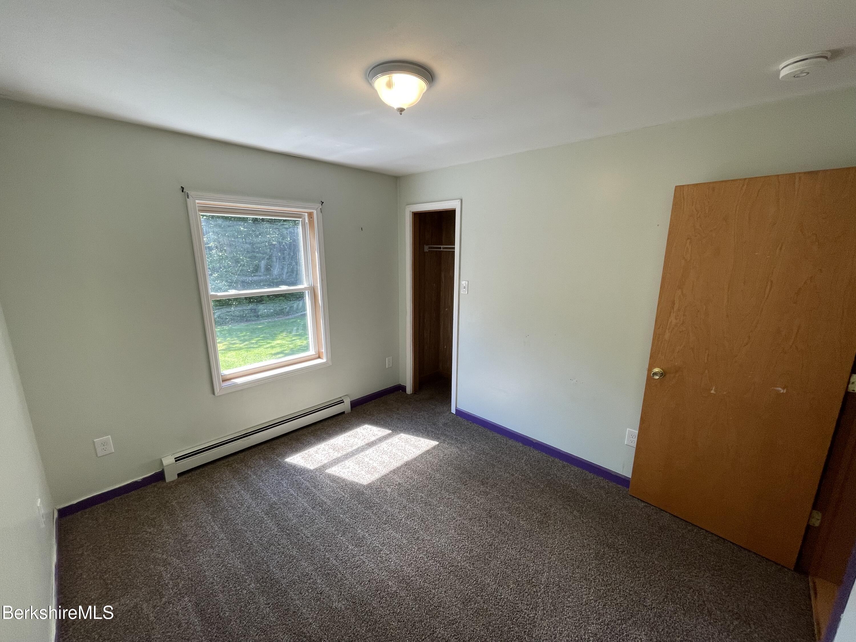 604 Loop Road Savoy, MA 01256 - Photo 11 of 23 an empty room with windows