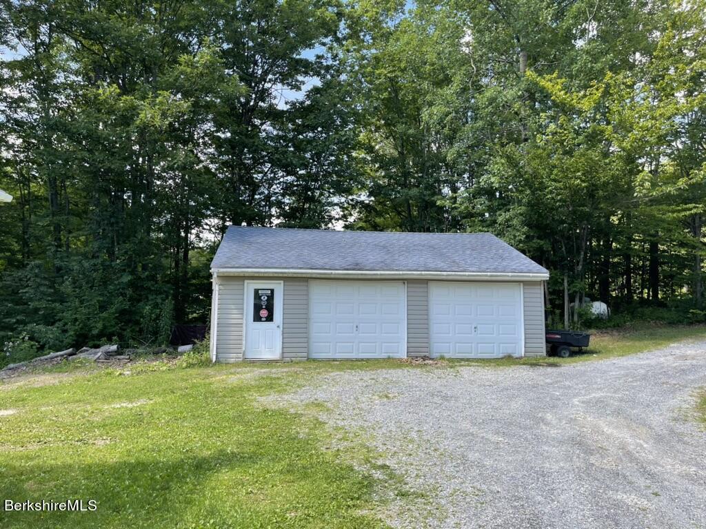 604 Loop Road Savoy, MA 01256 - Photo 20 of 23 a house with a tree in front of it
