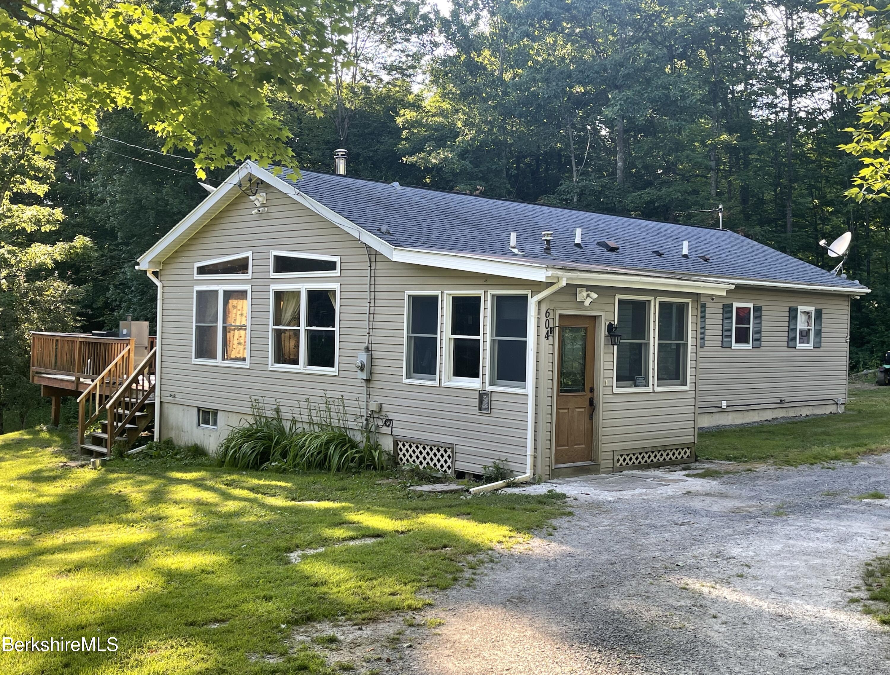 604 Loop Road Savoy, MA 01256 - Photo 2 of 23 a front view of a house with a yard