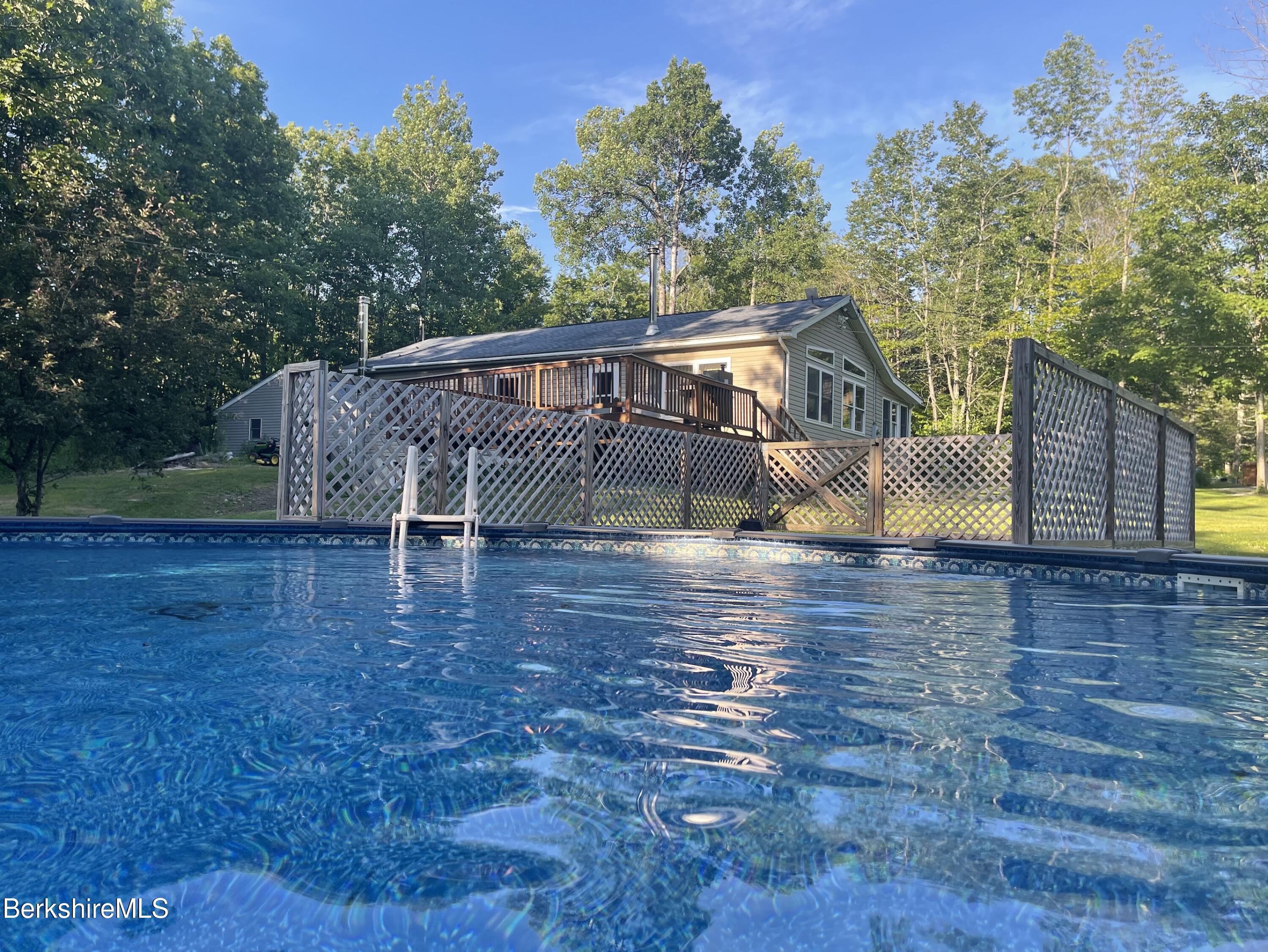 604 Loop Road Savoy, MA 01256 - Photo 23 of 23 a view of a roof deck with wooden floor and fence