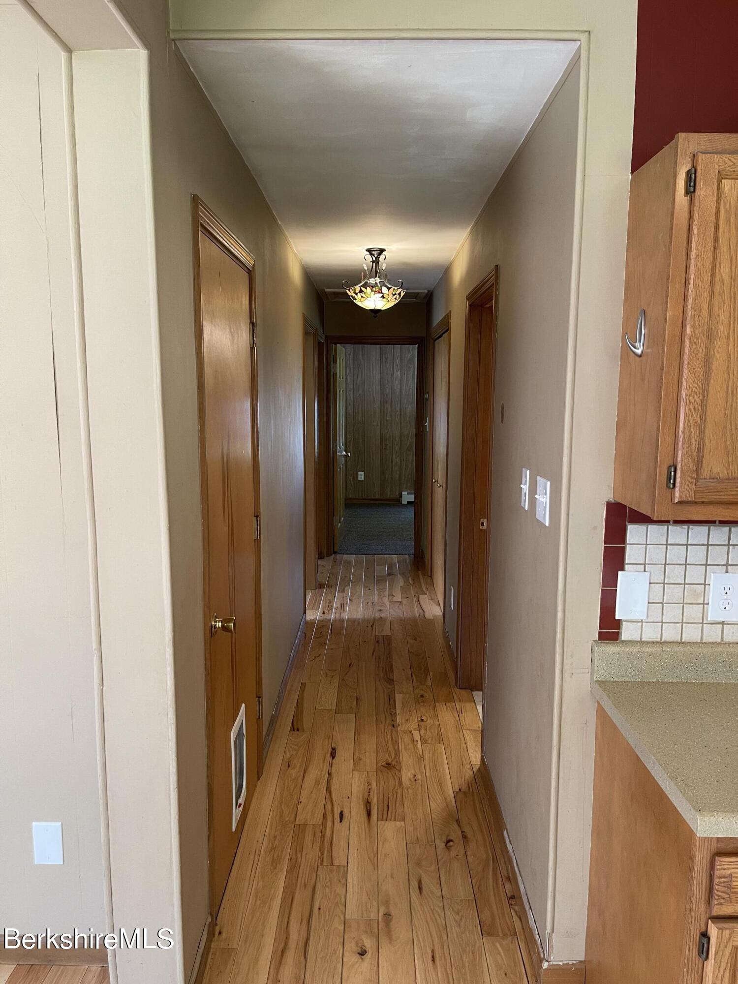 604 Loop Road Savoy, MA 01256 - Photo 7 of 23 a view of gallery with wooden floor