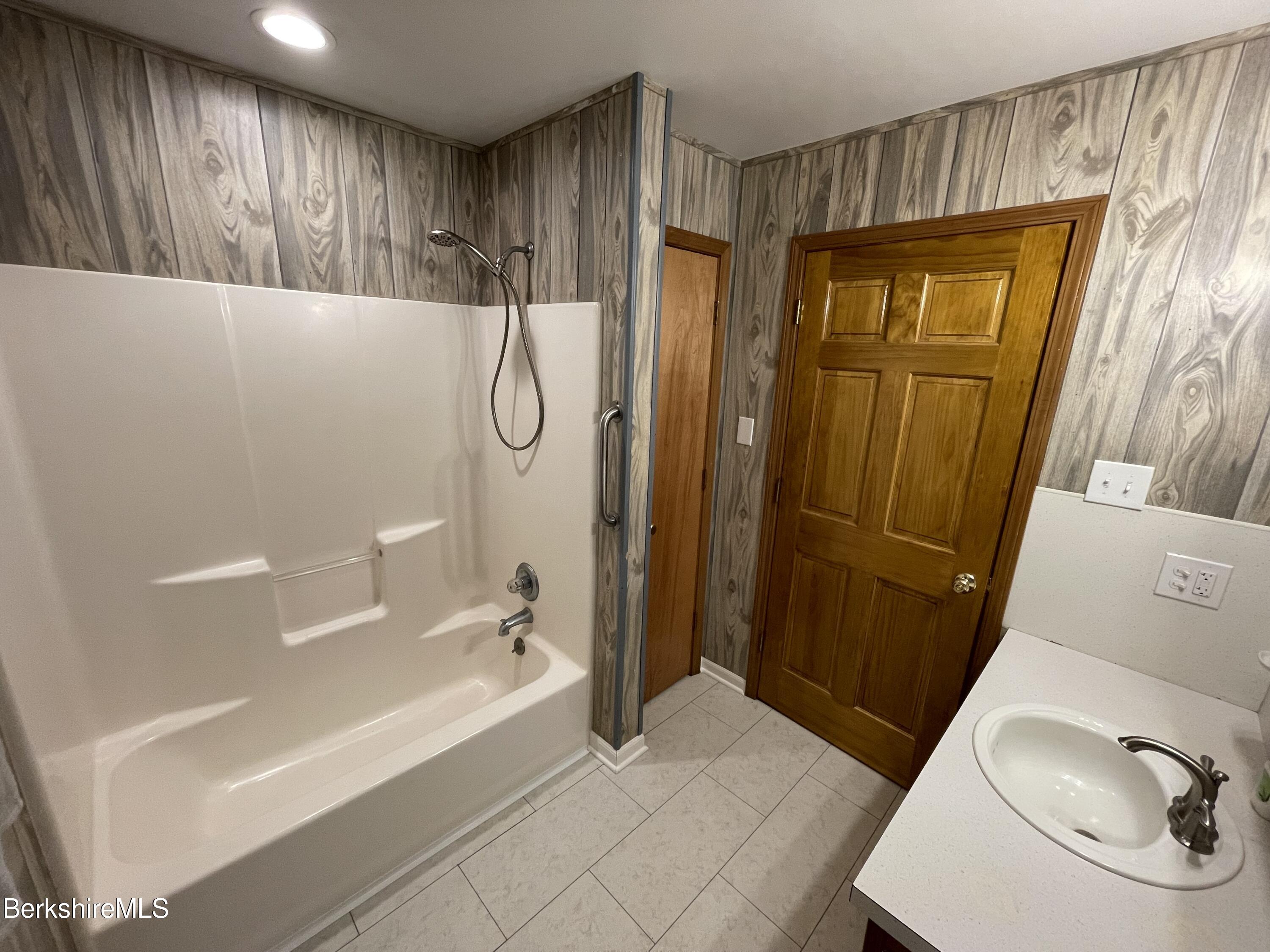 604 Loop Road Savoy, MA 01256 - Photo 9 of 23 a bathroom with a bathtub and a shower