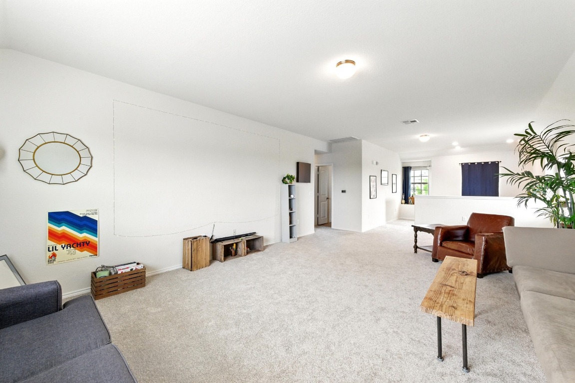 3905 Alpine Autumn Drive Austin, TX 78744 - Photo 13 of 24 View of carpeted living area