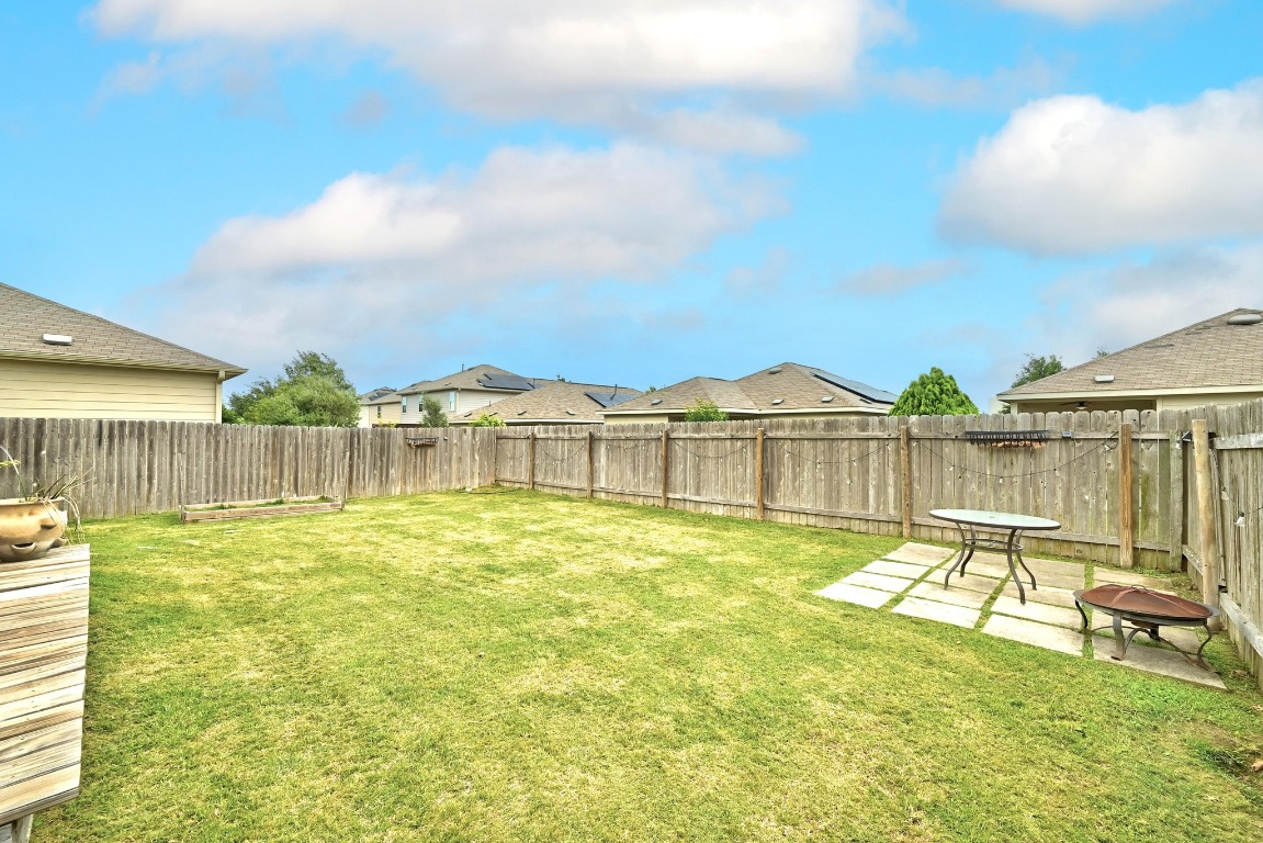 3905 Alpine Autumn Drive Austin, TX 78744 - Photo 18 of 24 View of yard with a fenced backyard and a patio area