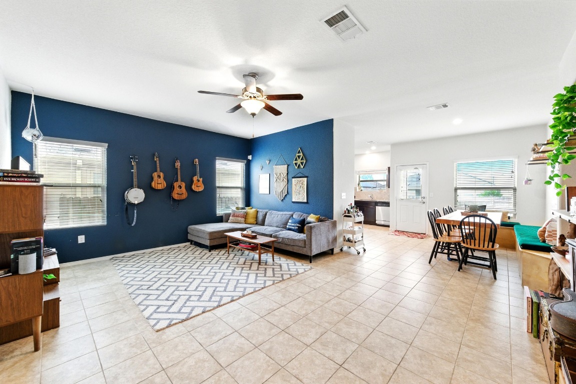 3905 Alpine Autumn Drive Austin, TX 78744 - Photo 2 of 24 Living area with visible vents, ceiling fan, and light tile patterned floors