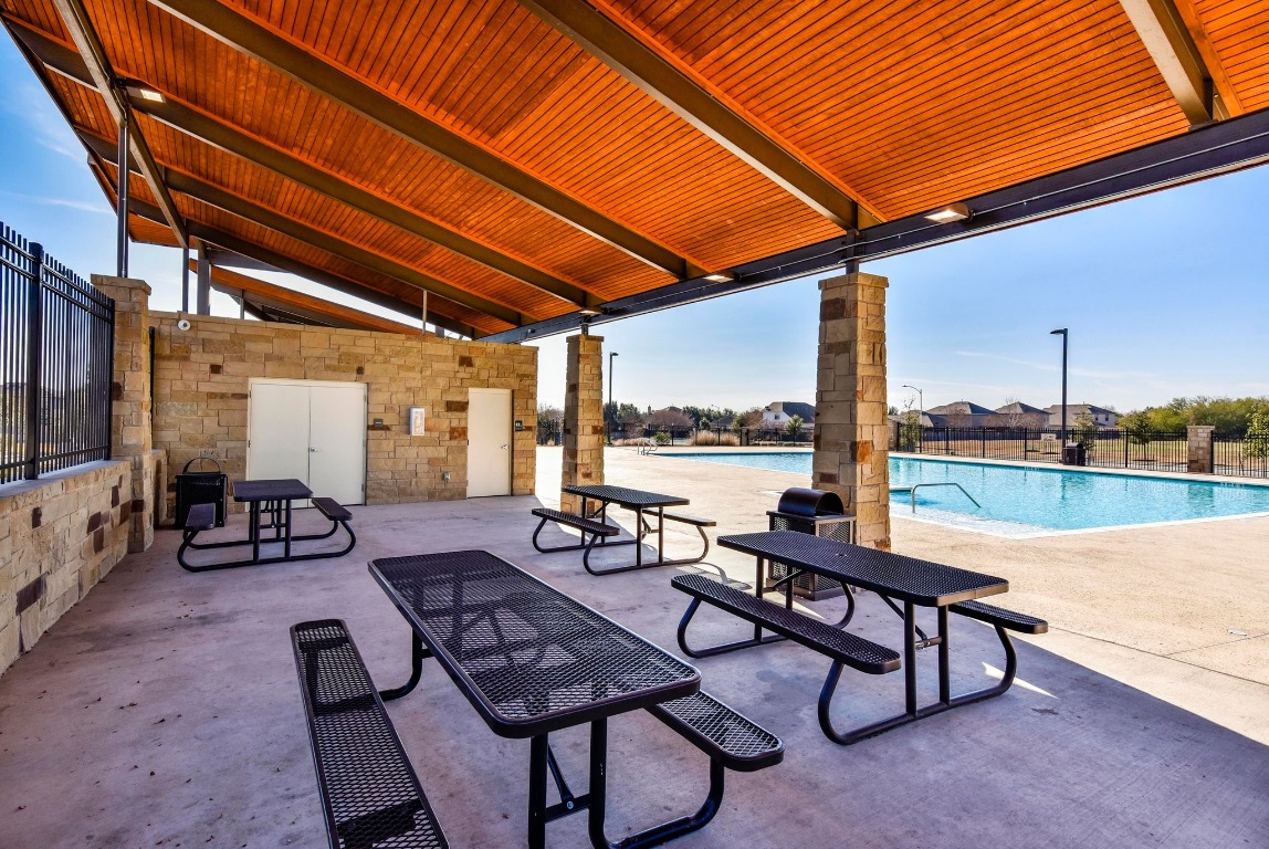 3905 Alpine Autumn Drive Austin, TX 78744 - Photo 21 of 24 View of patio / terrace with a community pool and fence