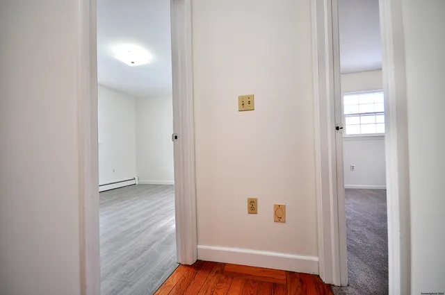 a view of a livingroom with wooden floor