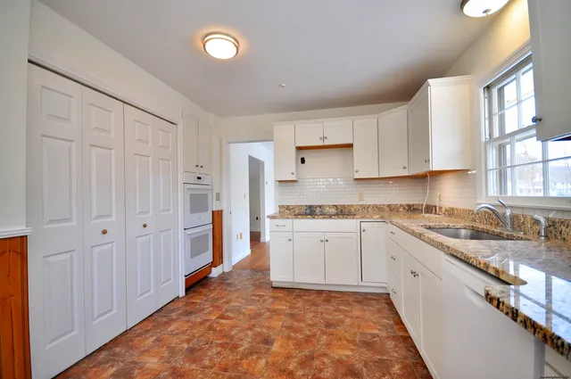 a large kitchen with cabinets