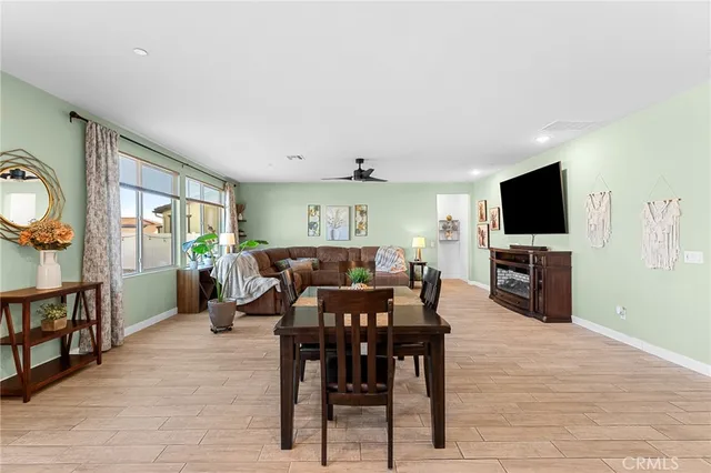 a view of a livingroom with furniture window and wooden floor