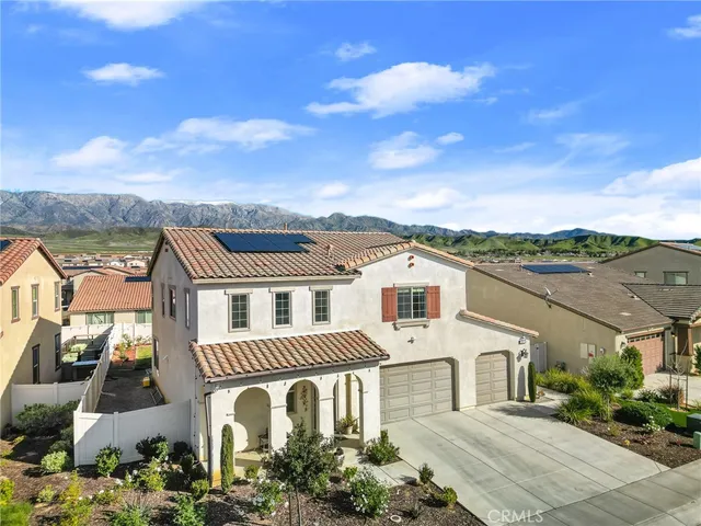 an aerial view of a house with a garden
