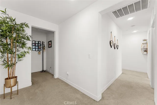 a bed room with a bed and a chandelier
