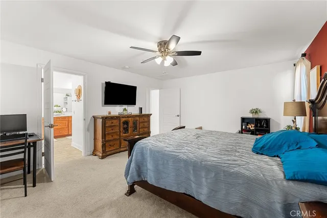 a spacious bathroom with a tub sink and mirror