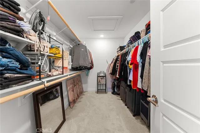 a kitchen with stainless steel appliances granite countertop a sink and a refrigerator