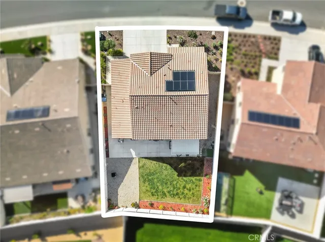 an aerial view of a residential apartment building with a yard