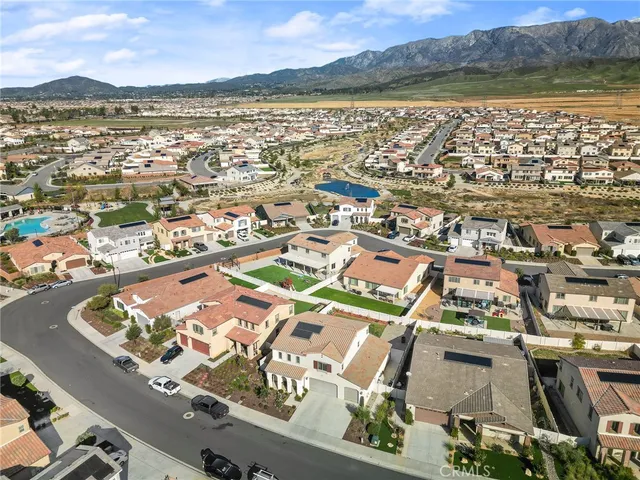 an aerial view of residential building with outdoor space and river