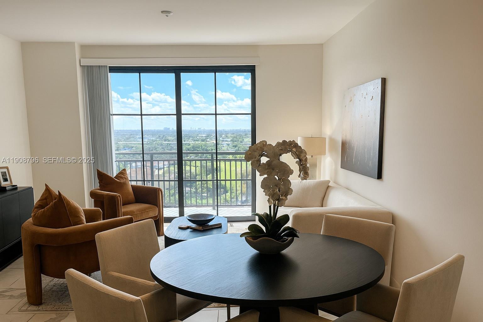 101 East Camino Real, Unit 1025 Boca Raton, FL 33432 - Photo 3 of 10 a living room with furniture and a potted plant