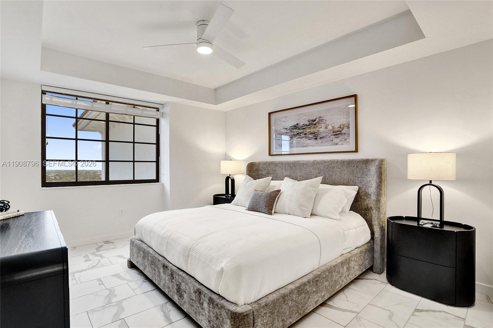 101 East Camino Real, Unit 1025 Boca Raton, FL 33432 - Photo 7 of 12 a bedroom with a bed and a window