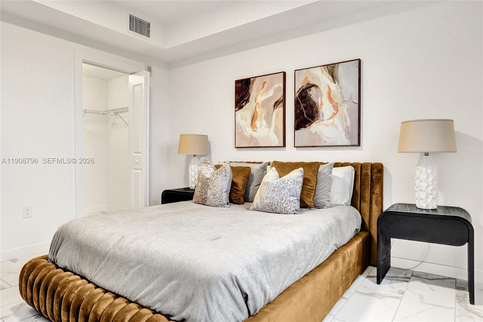 101 East Camino Real, Unit 1025 Boca Raton, FL 33432 - Photo 8 of 12 a bedroom with a bed and painting on the wall