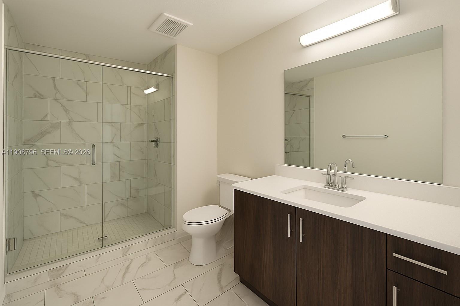 101 East Camino Real, Unit 1025 Boca Raton, FL 33432 - Photo 10 of 12 a bathroom with a sink toilet a mirror and shower