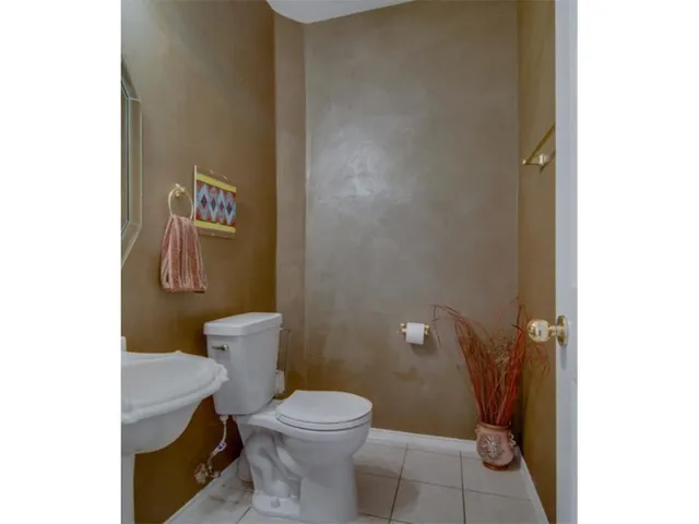 a bedroom with a bed and a fireplace