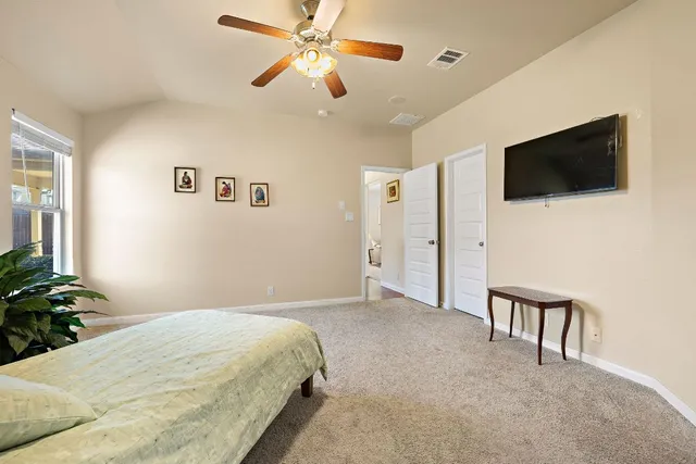 a bed room with a bed and a chandelier