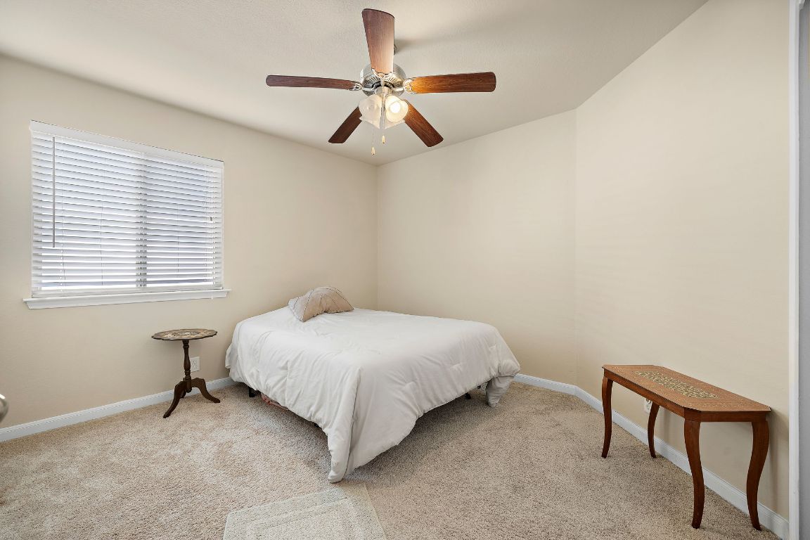 227 Avalanche Avenue Georgetown, TX 78626 - Photo 18 of 27 a bedroom with a bed and a window