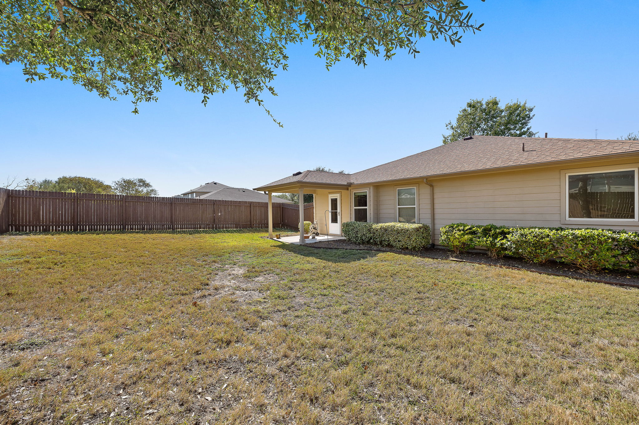 227 Avalanche Avenue Georgetown, TX 78626 - Photo 23 of 27 Fenced backyard with a patio area