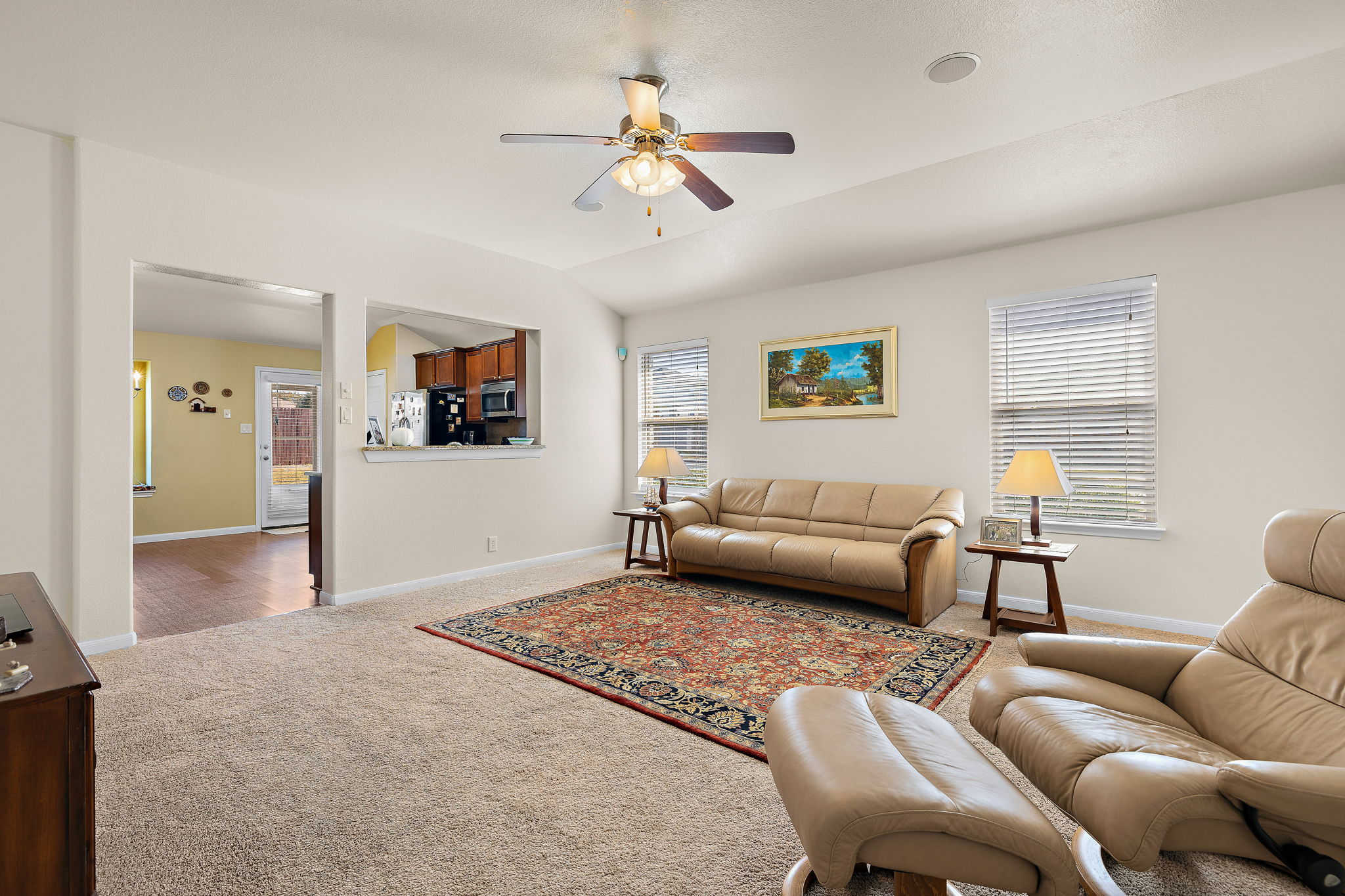 227 Avalanche Avenue Georgetown, TX 78626 - Photo 4 of 27 Carpeted living room featuring ceiling fan and lofted ceiling