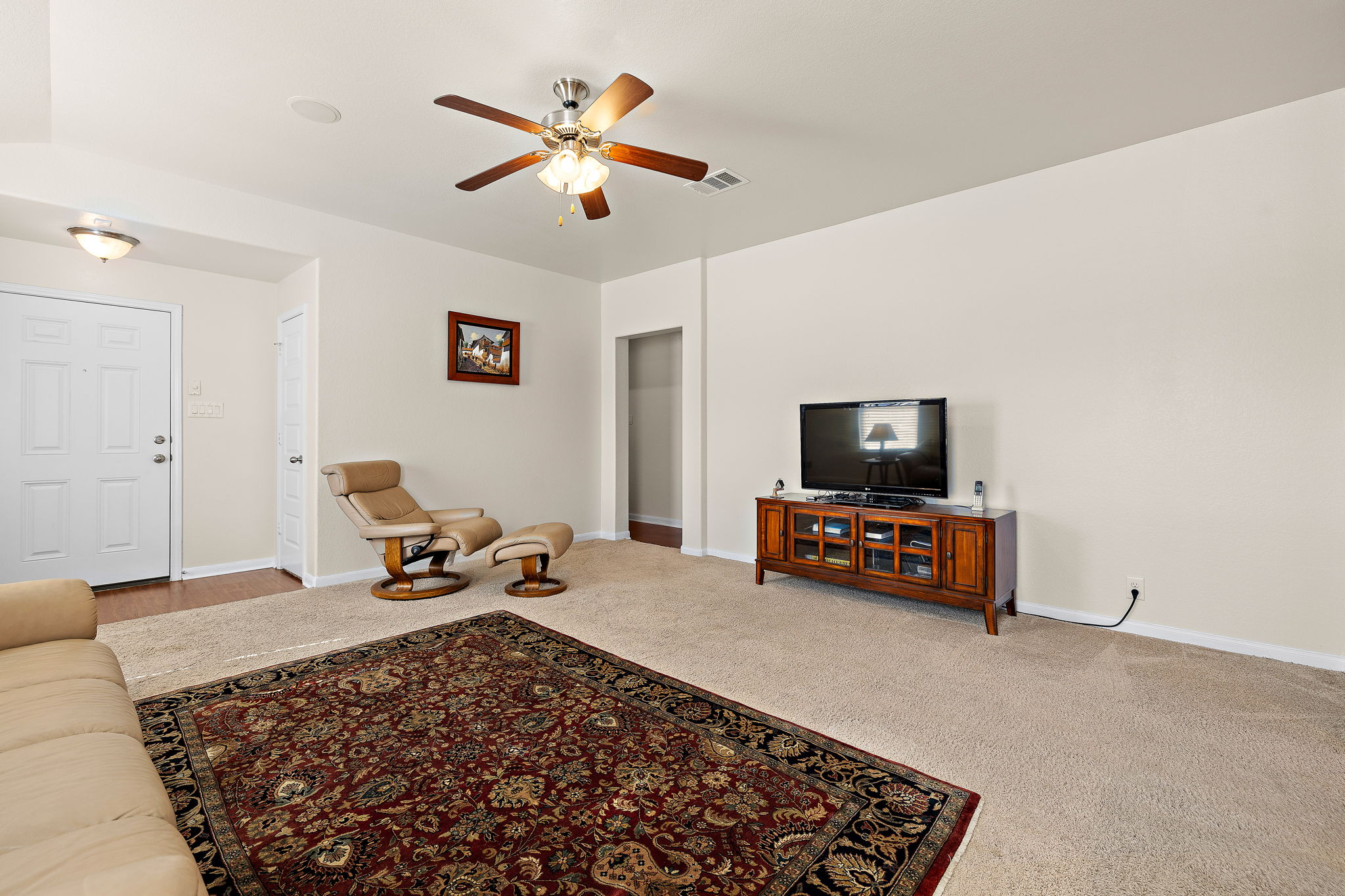 227 Avalanche Avenue Georgetown, TX 78626 - Photo 6 of 27 Living room with carpet floors and a ceiling fan