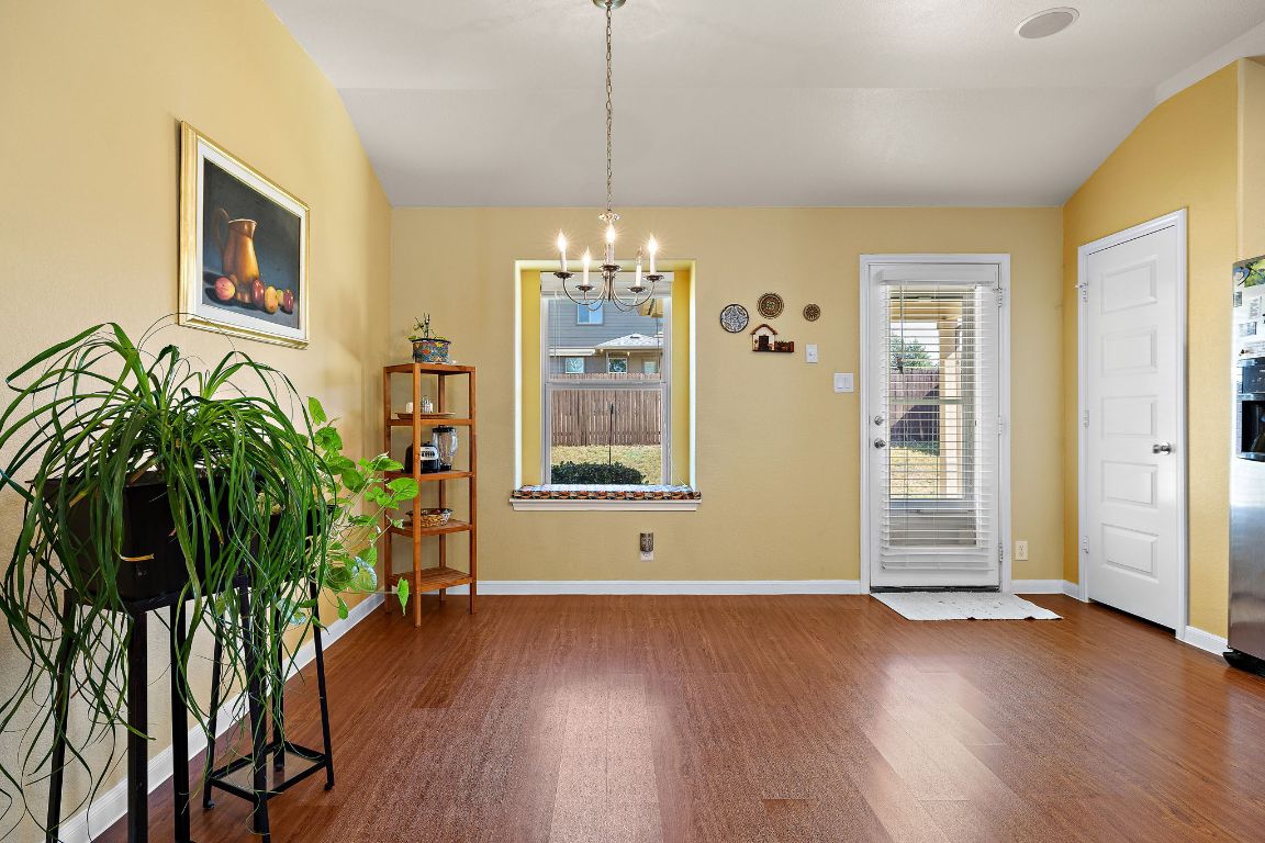 227 Avalanche Avenue Georgetown, TX 78626 - Photo 8 of 27 a view of a room with wooden floor and potted plant