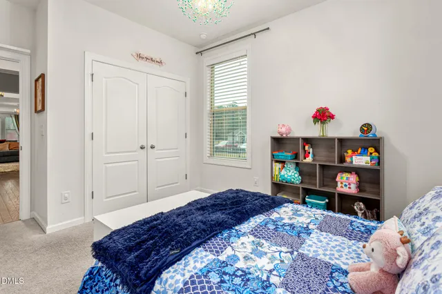 a bedroom with a bed and a window in it