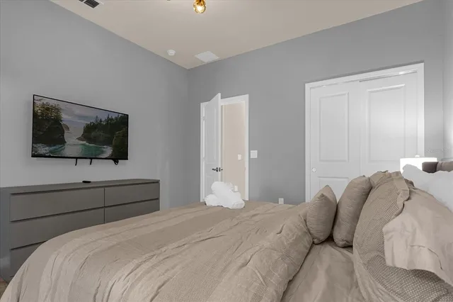 a bathroom with a granite countertop sink a large mirror and a window