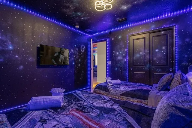 a bed room with a bed and a lamp