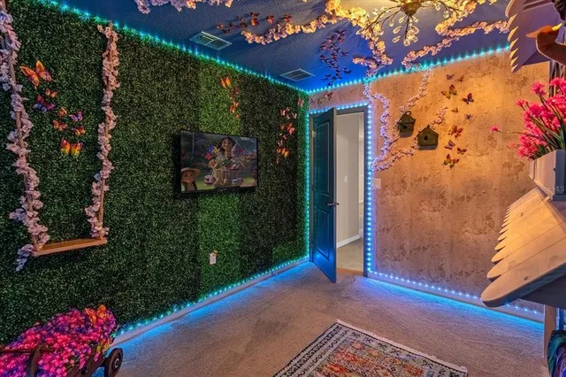 a bathroom with a granite countertop sink a toilet and a mirror