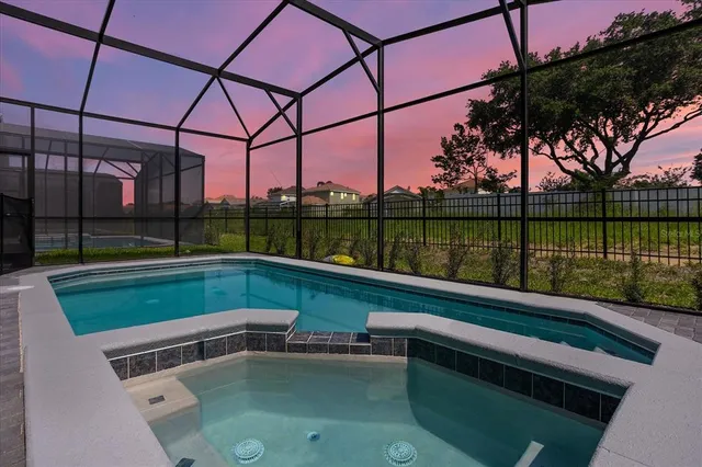 an aerial view of residential houses with outdoor space and city view