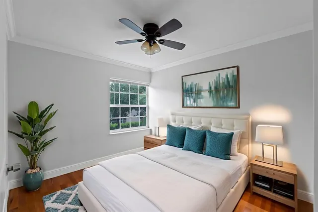 a bedroom with a large bed and a window