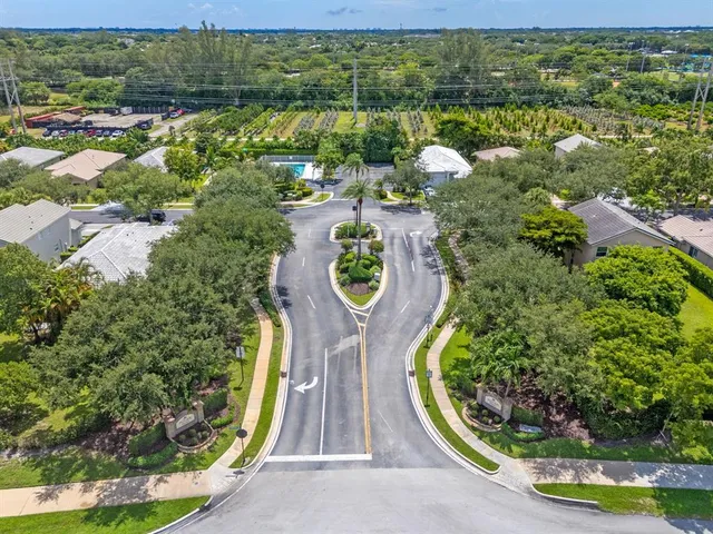 an aerial view of a house with a swimming pool